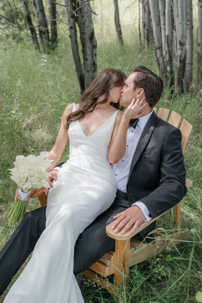 Foster Creek Farm Wedding Montana bride and groom sitting in woods